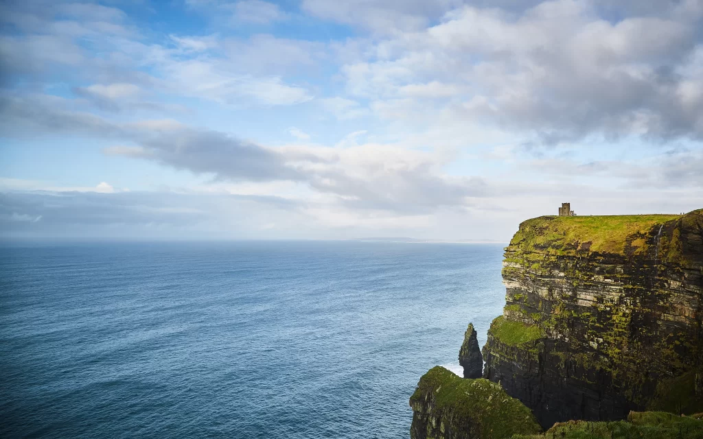 ocean cliffs sky clouds