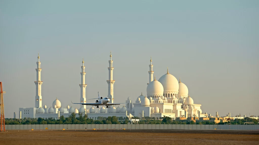 plane mosque domes minarets sky runway
