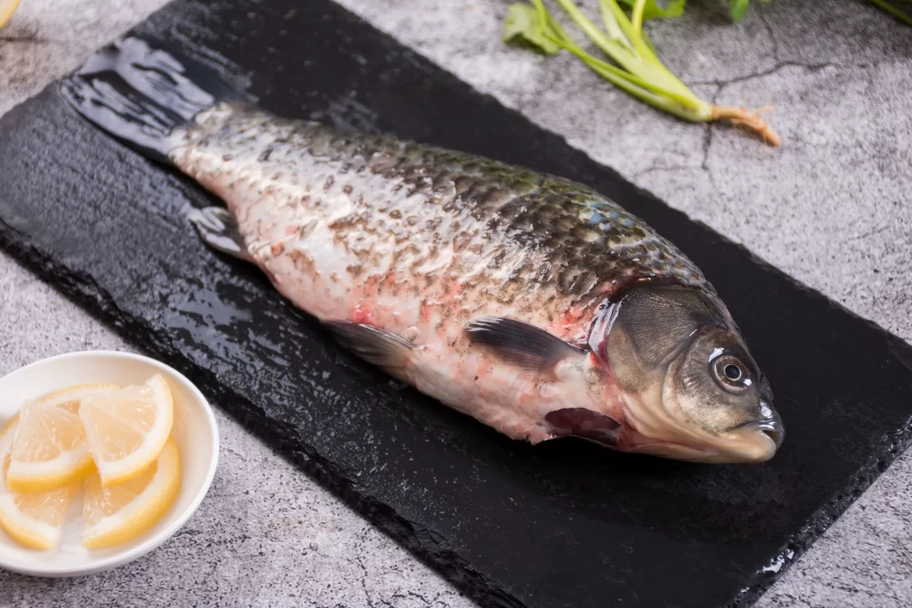Raw Fish Whole Black Slate Lemon