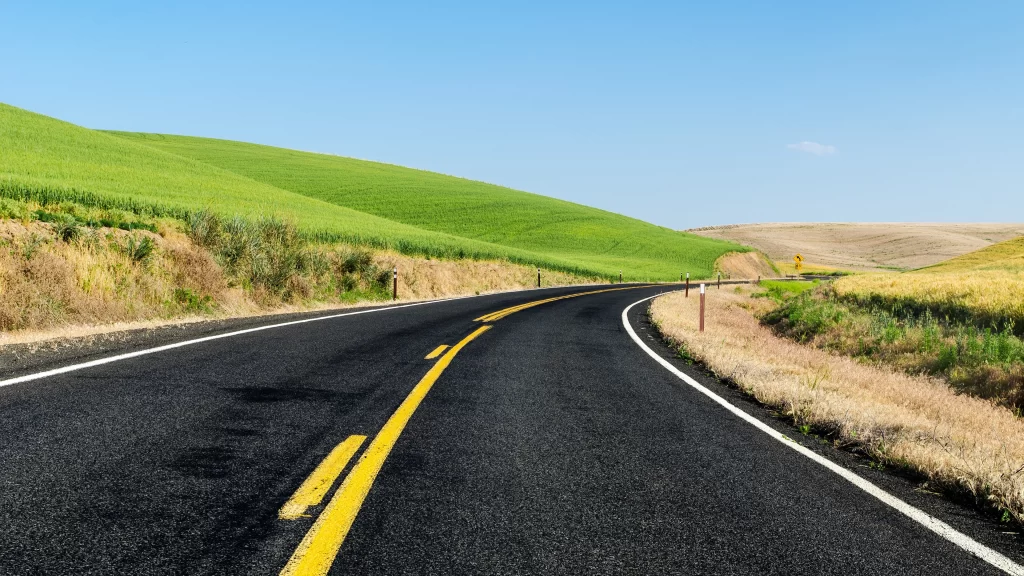 road countryside green hills landscape travel
