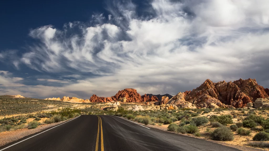 road desert landscape sky clouds