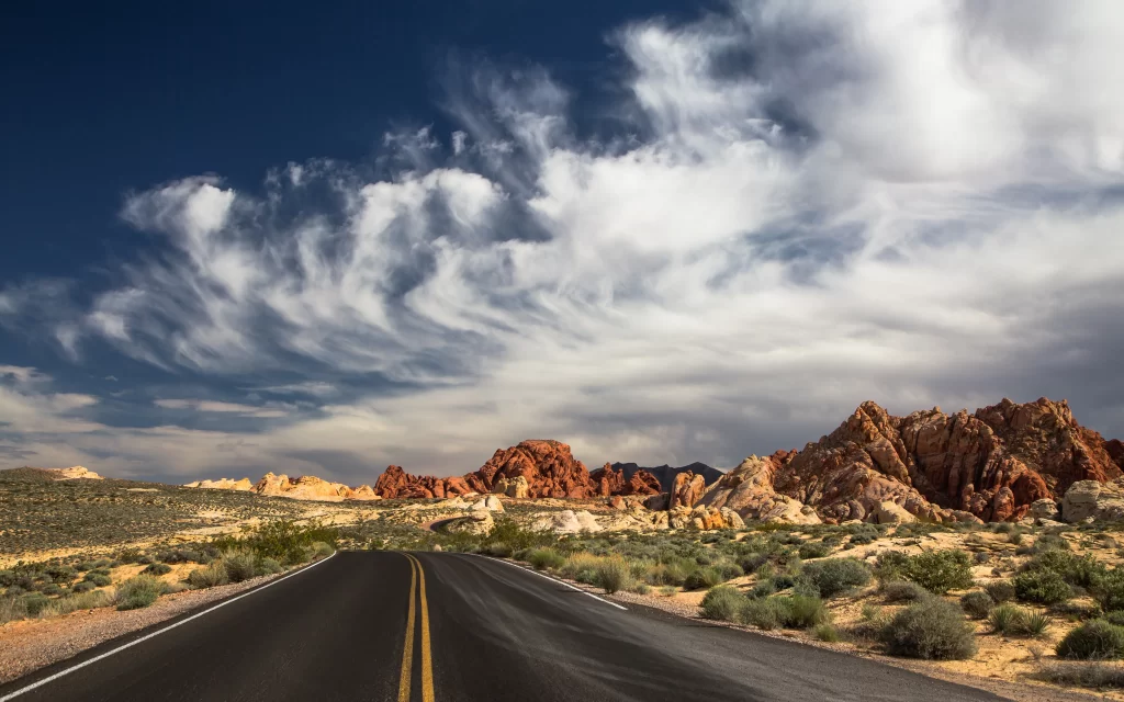 road desert landscape sky clouds nature
