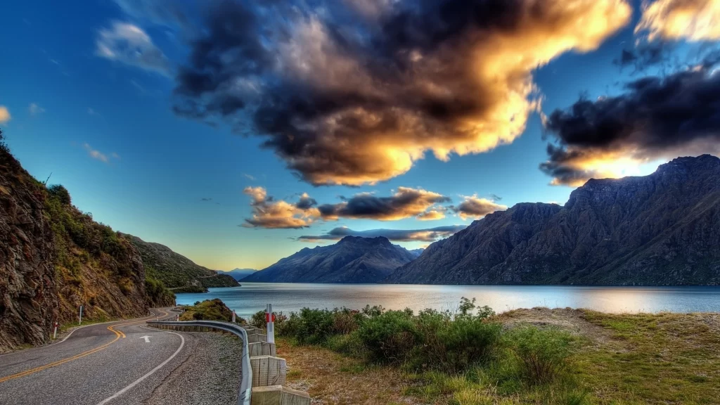 road lake mountains clouds sunset landscape