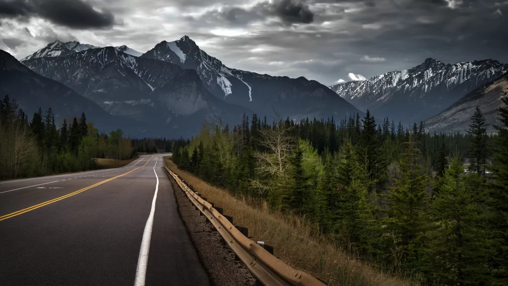 road mountains forest clouds sky