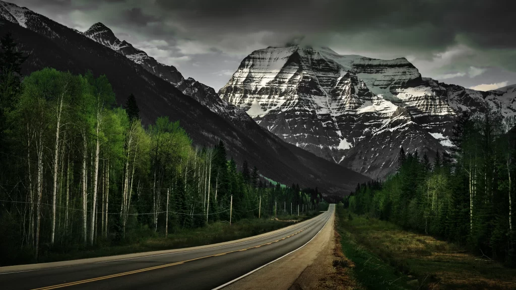 road mountains trees sky clouds