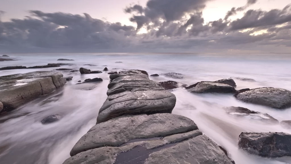 seascape rocks clouds sky water horizon