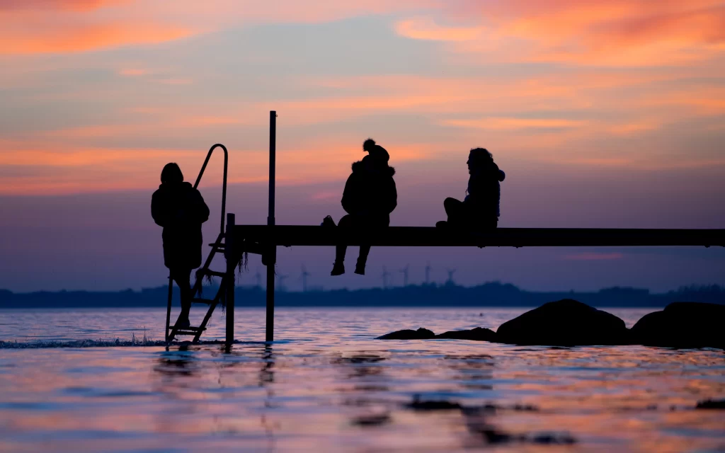 silhouette sunset pier water sky reflection
