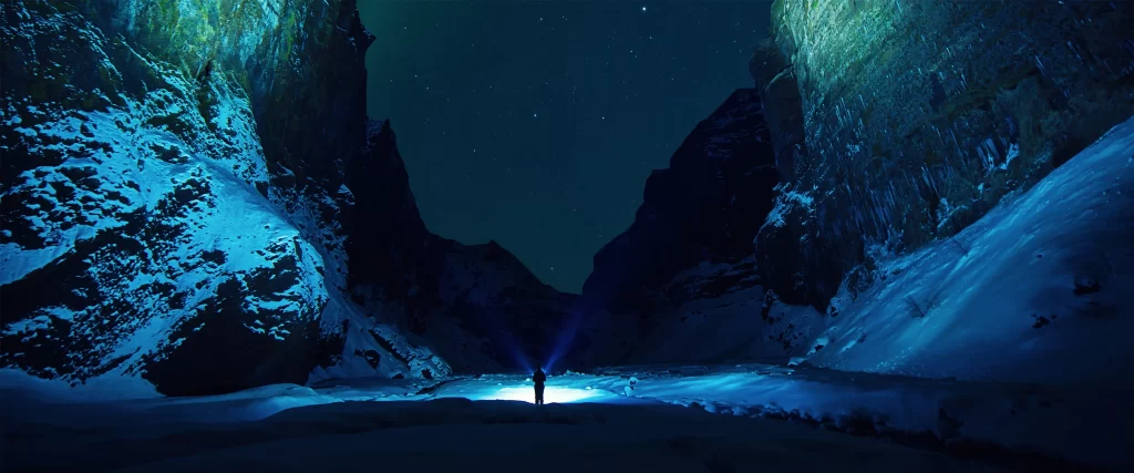snowy mountain night stars solitude flashlight