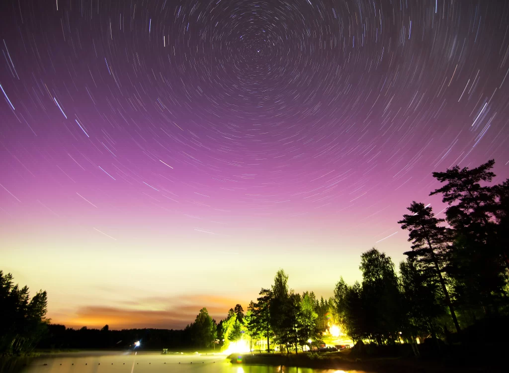 starry sky long exposure aurora trees lake twilight reflection colors