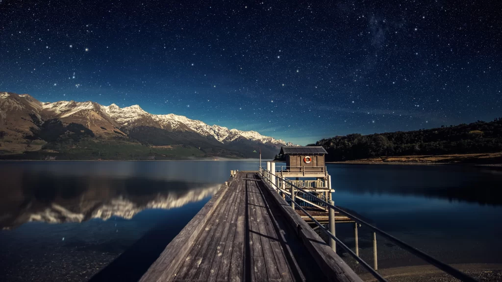 stars night sky lake mountains pier