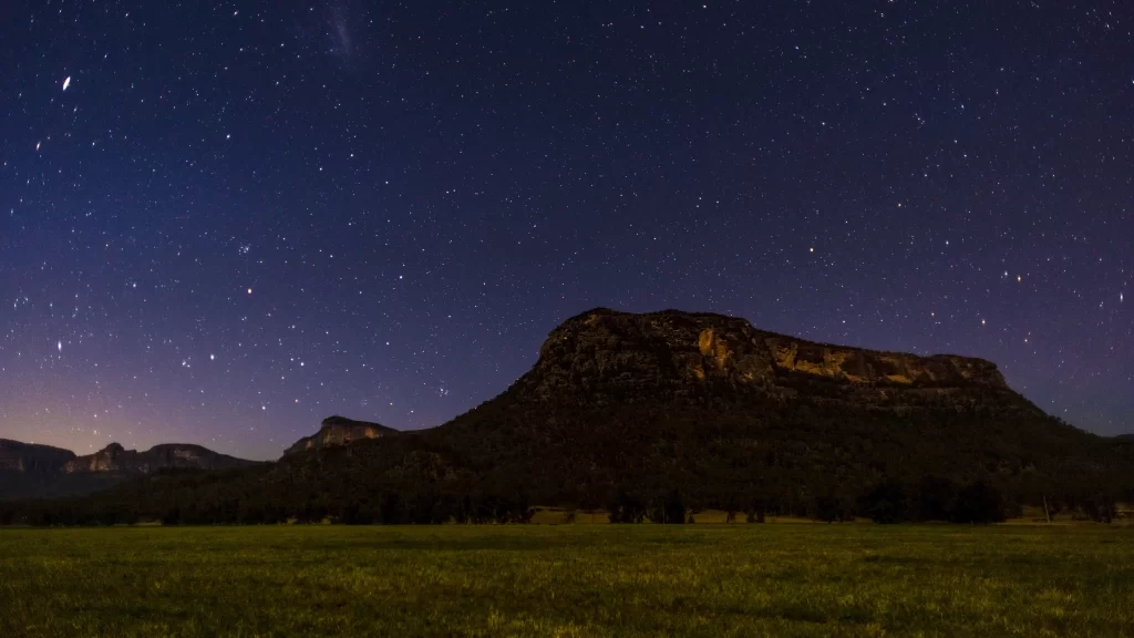 stars night sky mountain landscape grass