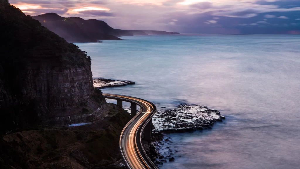 twilight coastal road cliffs ocean serene