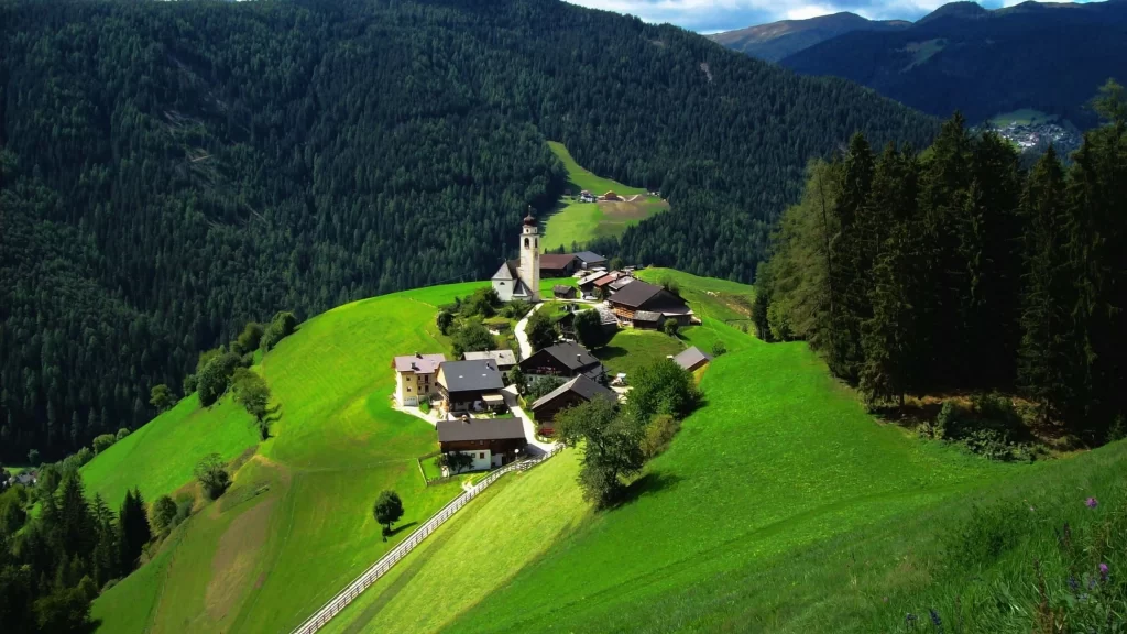 village green hills buildings trees landscape