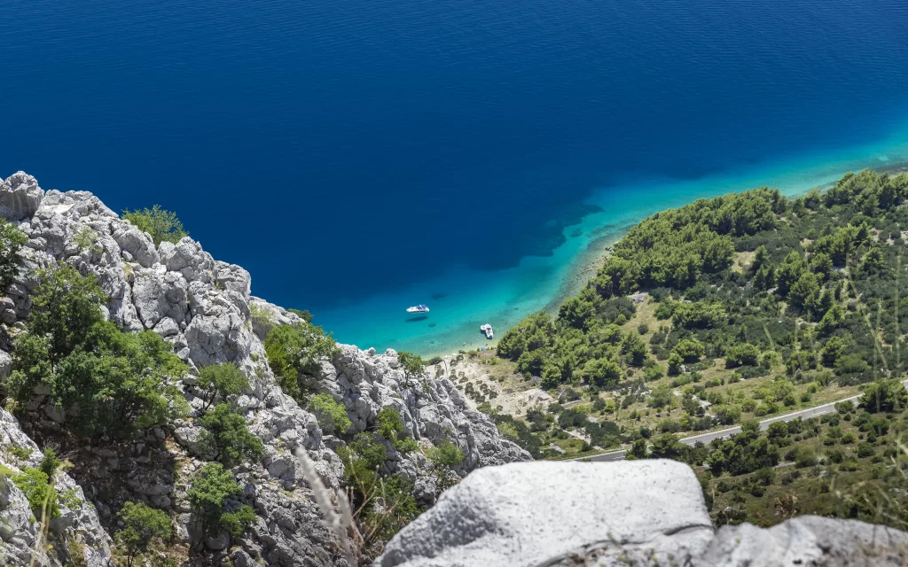 Calm Sea Rocky Coastline Greenery Boats