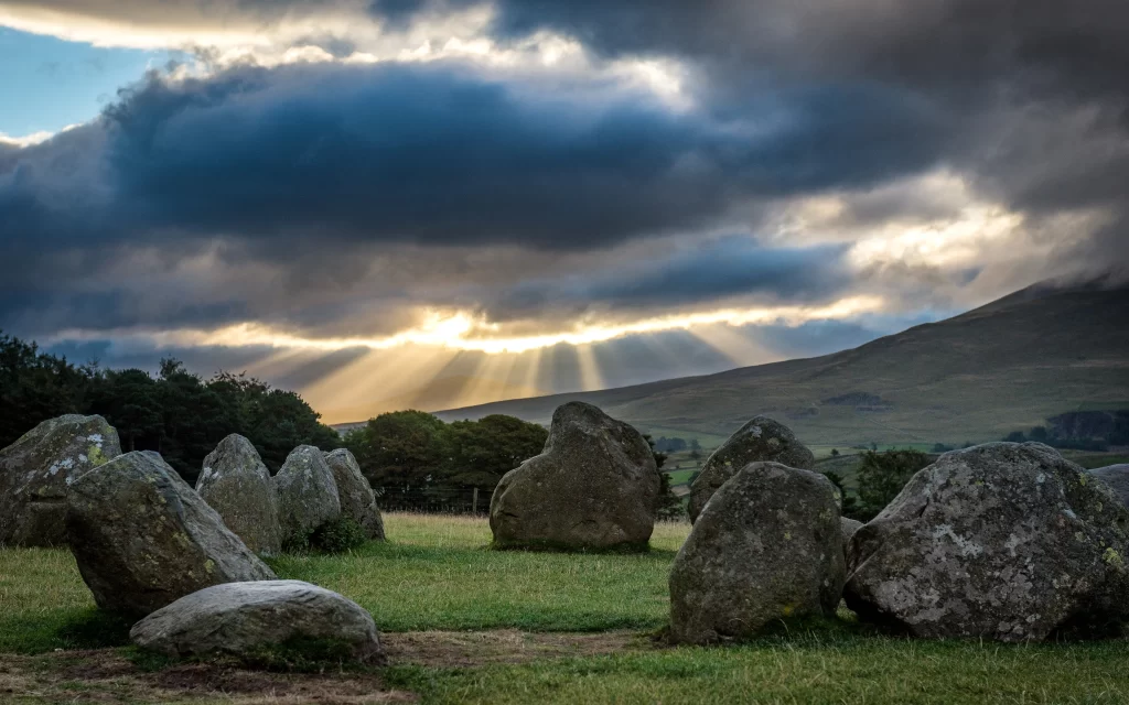 Sunset Clouds Rays Stones Meadow