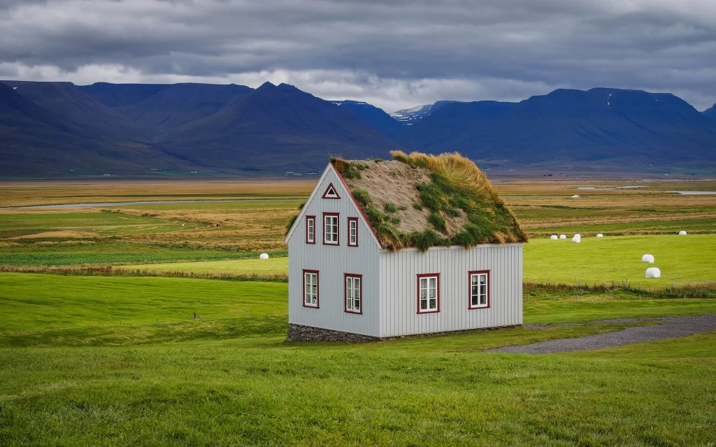 Rural House Green Grass Mountains Cloudy Sky