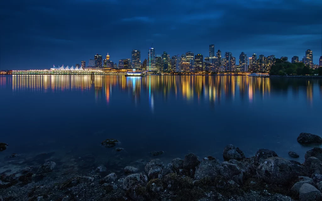 Cityscape Night Lights Reflection Water Rocks