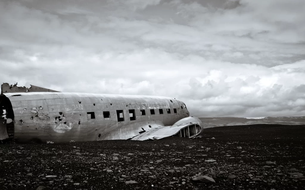 Abandoned Plane Rocky Terrain Cloudy Sky