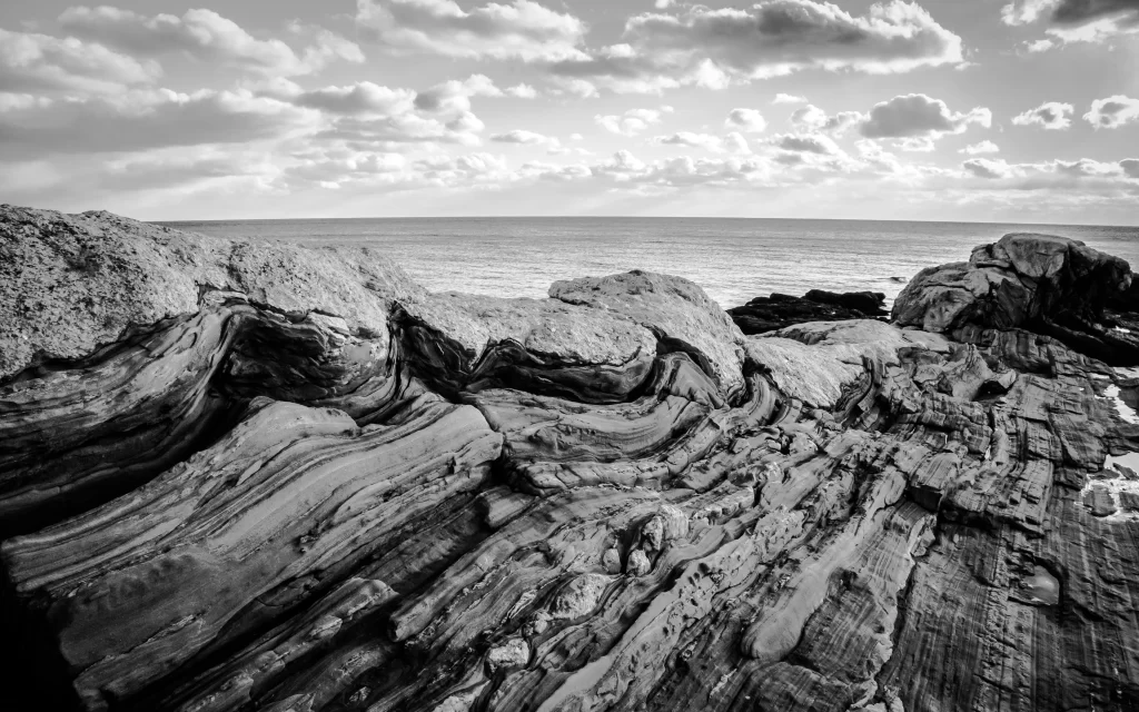 Rugged Coastline Rocky Terrain Cloudy Sky Ocean Horizon