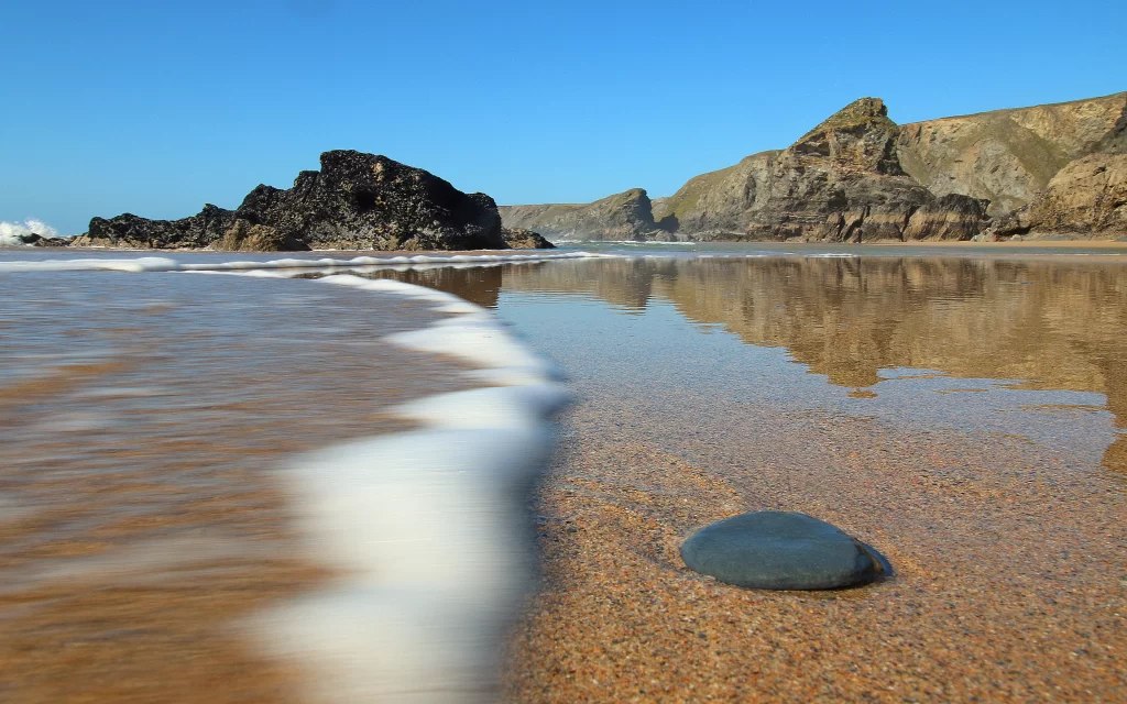 Beach Ocean Waves Rocky Shoreline Reflections Blue Sky