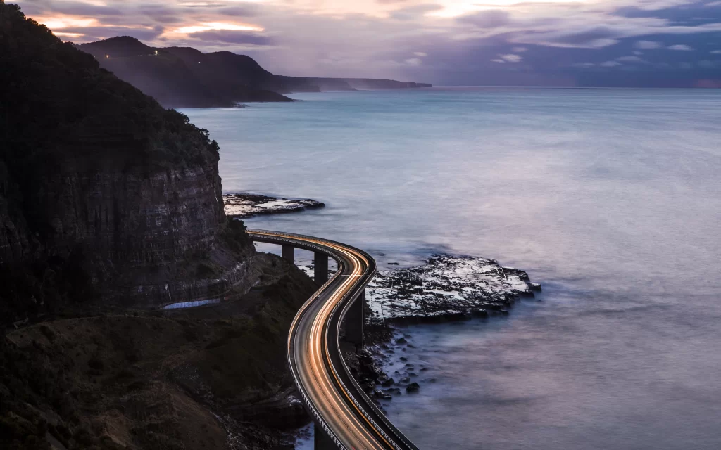 Twilight Coastal Highway Cliffside Ocean Rocks