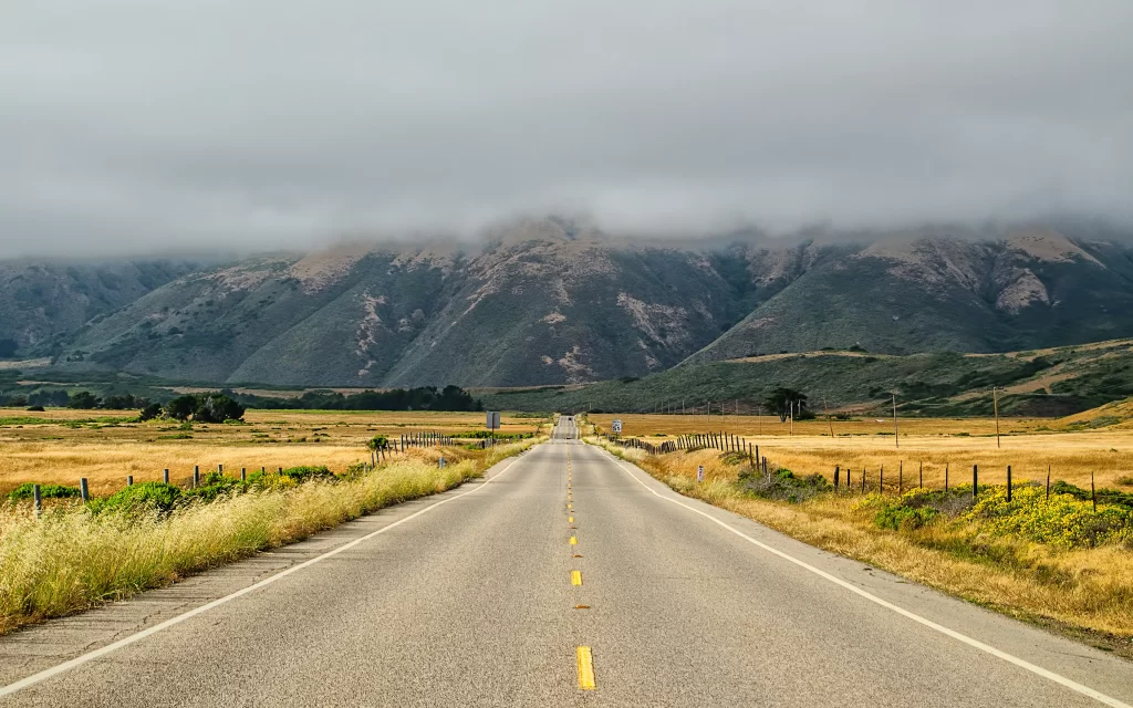 Open Road Rolling Hills Cloudy Sky Rural Landscape