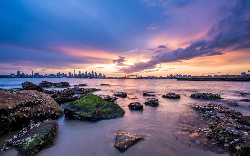 Sunset Cityscape Water Rocks Scenic