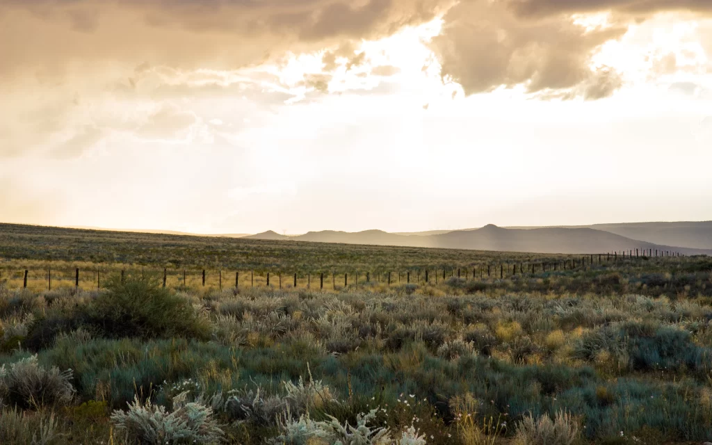 Sunset Prairie Grasslands Fence Rolling Hills Cloudy Sky