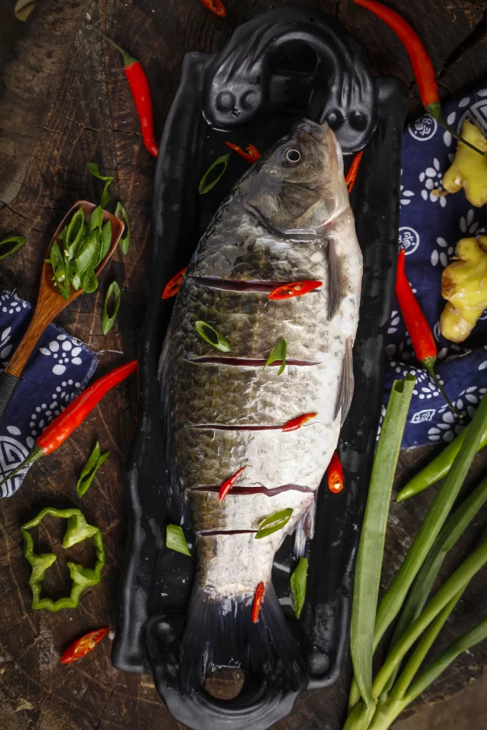 Whole Fish Black Plate Red Chili Green Onion