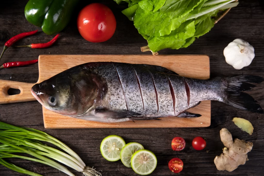 Whole Fish Fresh Ingredients Green Vegetables Red Tomato
