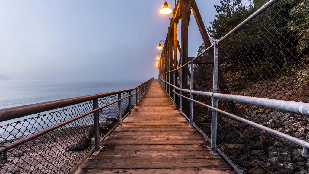 Wooden Bridge Metal Railing Street Lamps Foggy Calm Serene