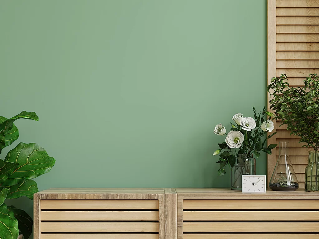 Wooden Cabinet with Botanical Decor on Sage Green Wall