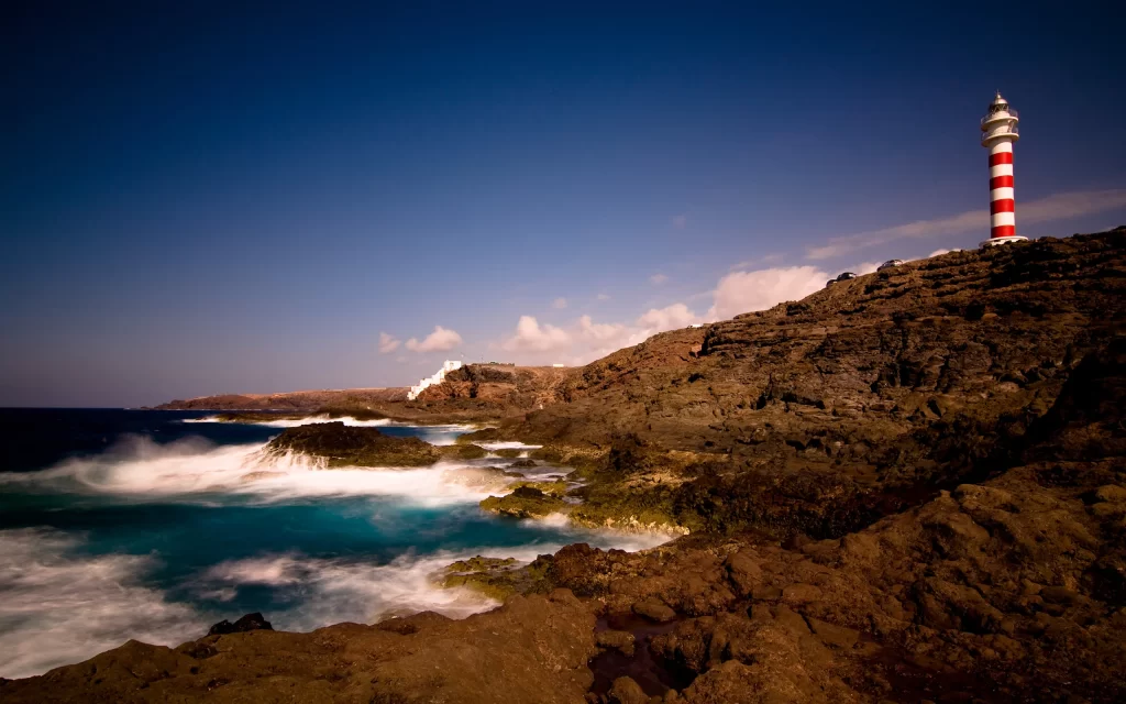 Lighthouse Ocean Waves Rocky Coastline Blue Sky White Clouds