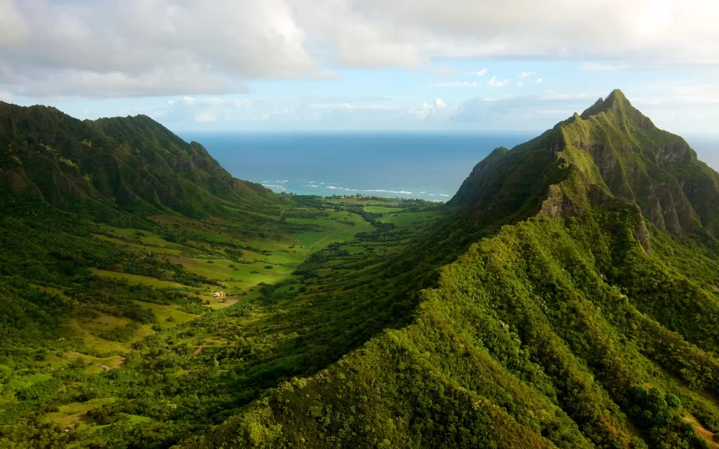 Lush Green Mountains Ocean Blue Sky Clouds Scenic