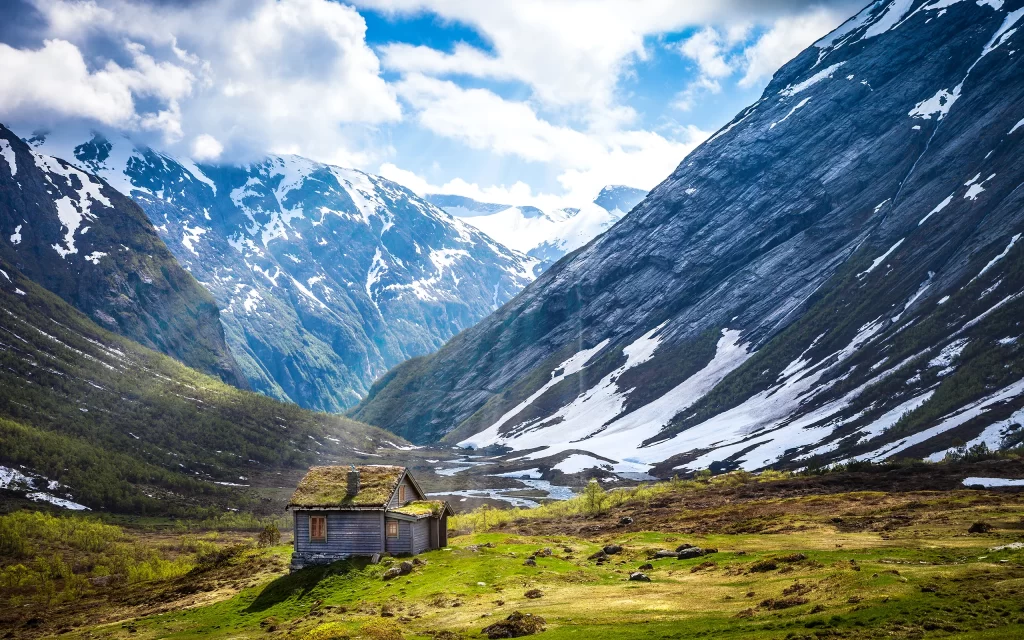Mountainous Landscape Snow Peaks Green Valley Cottage Blue Sky