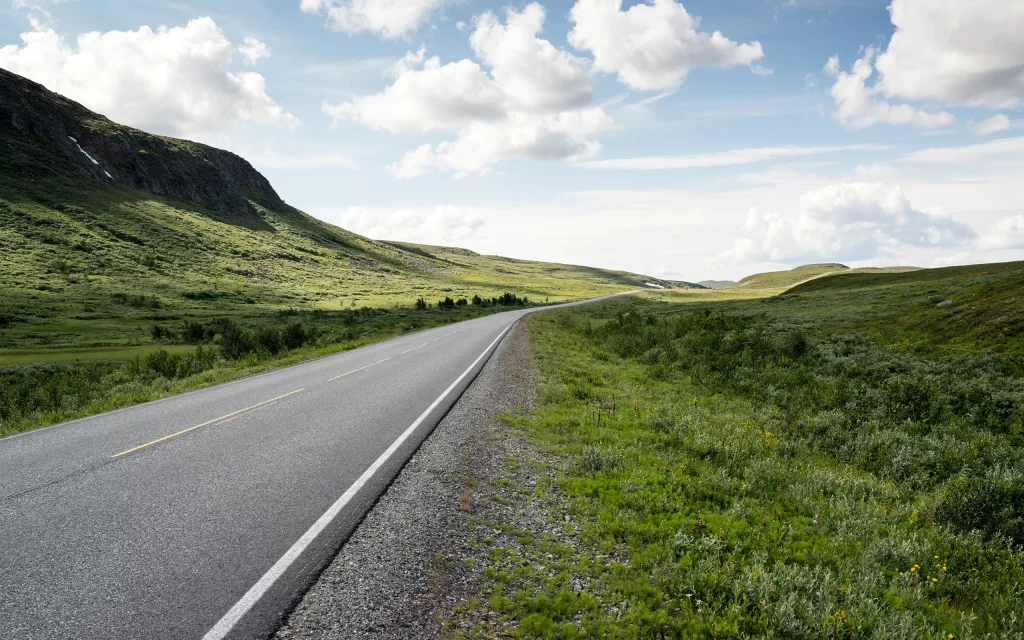 Open Road Green Hills Blue Sky Clouds Scenic