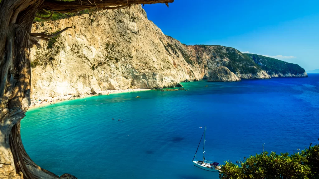 Sailboat Ocean Cliffs Beach Blue Sky Greenery
