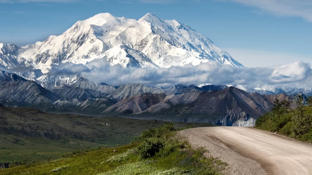 Snowy Mountain Peaks Clouds Road Greenery Scenic
