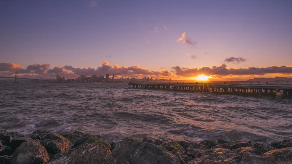 Sunset Cityscape Water Pier Rocks