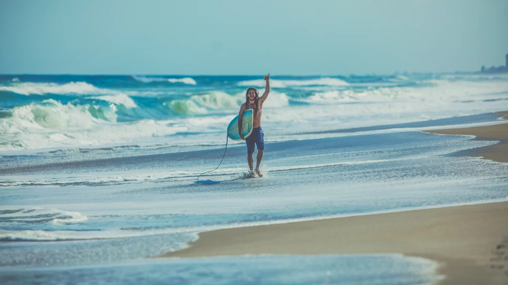 Surfer Ocean Waves Beach Blue Sky Sunlight
