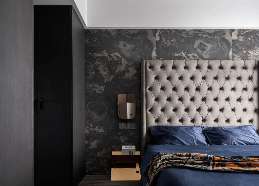 Bedroom Dark Marble Textured Headboard Blue Bedding Patterned Throw