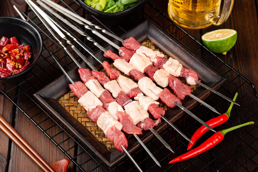Beef and Chicken Skewers Fresh Red Chili Garnish