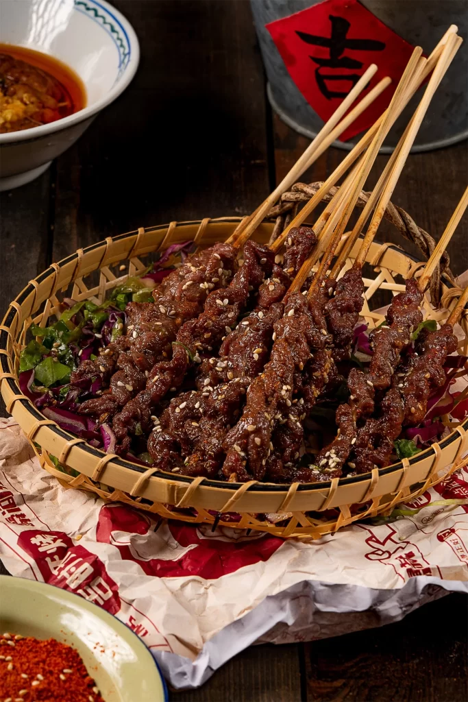 Beef Skewers Charred Crust Sesame Seeds Garnish