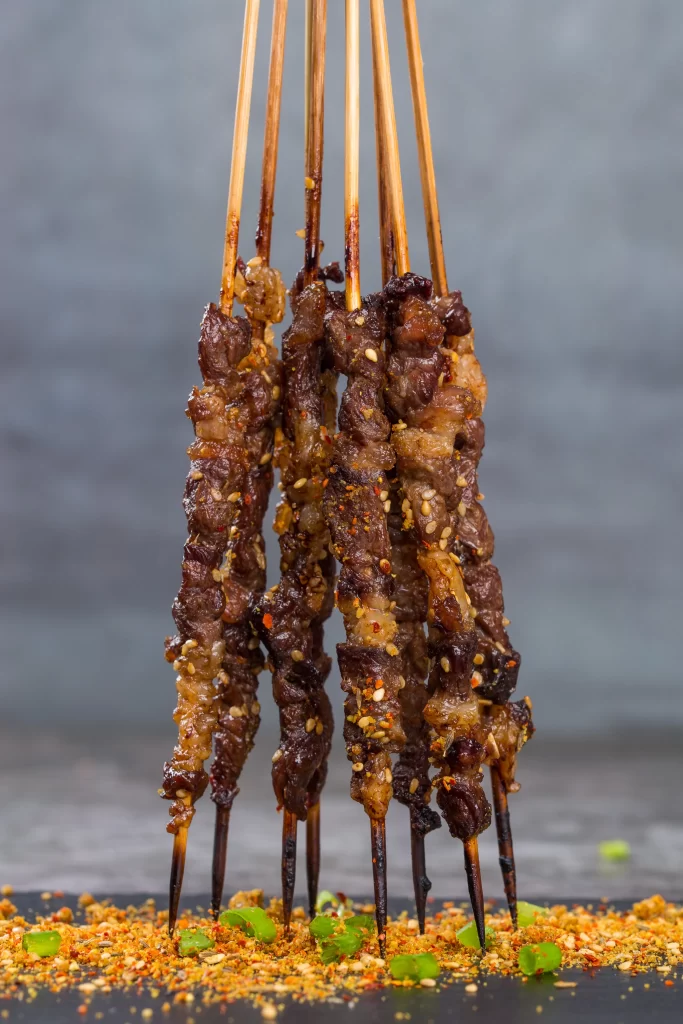 Beef Skewers Charred Crust Spices Golden Brown Close Up