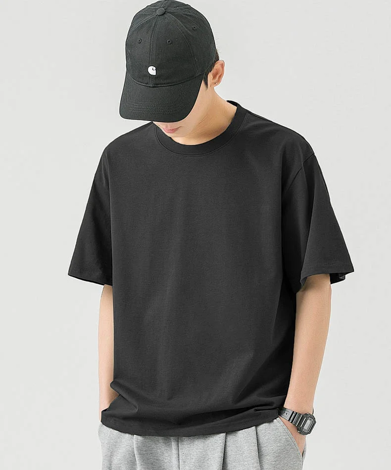 Black T-shirt Baseball Cap Watch Grey Pants