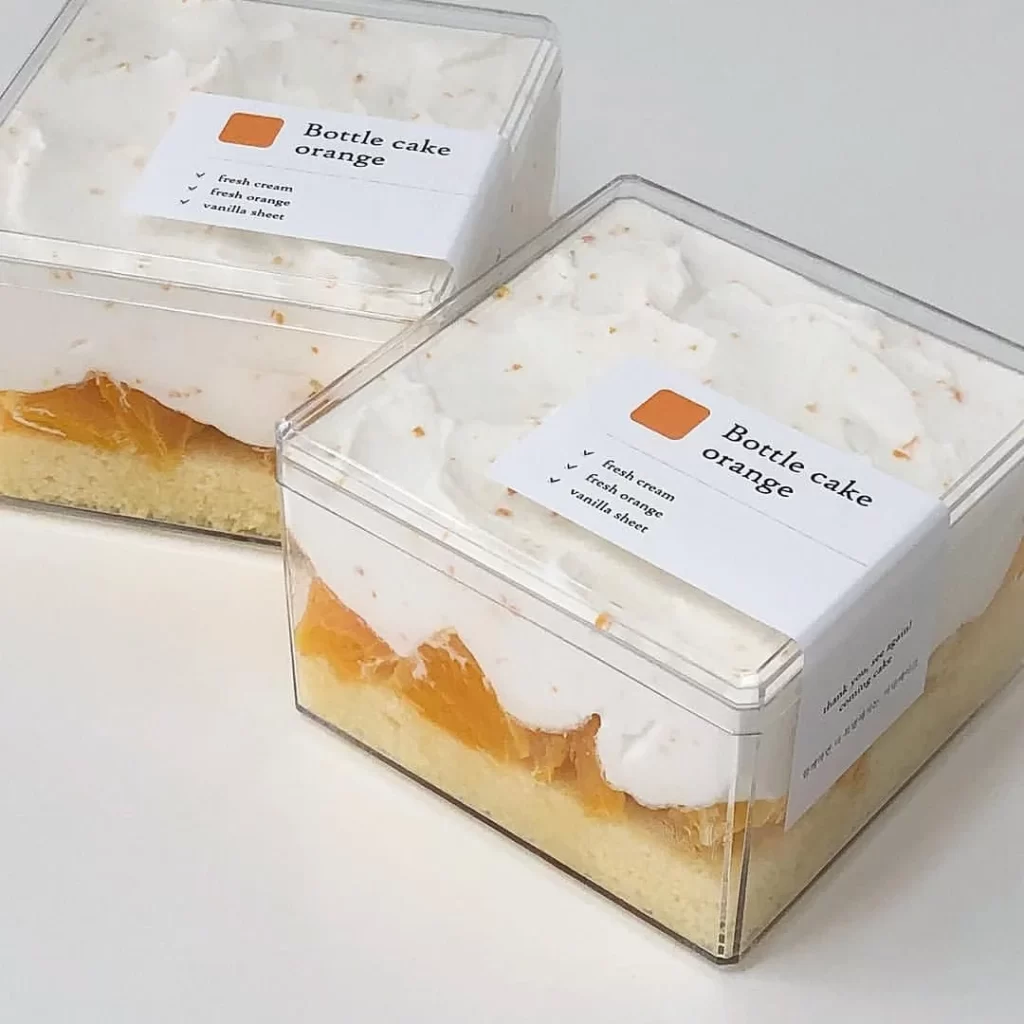 Cake Packaging Clear Box Orange Cream Layered Modern Design