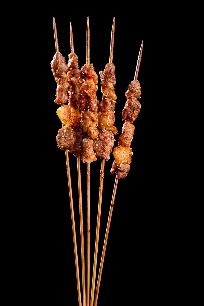 Charred Beef Skewers Sesame Seeds Golden Crust Close Up