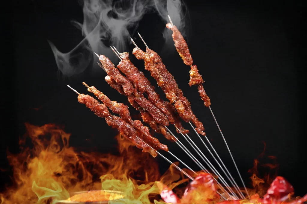 Charred Beef Skewers Smoke Rising Golden Brown Crust