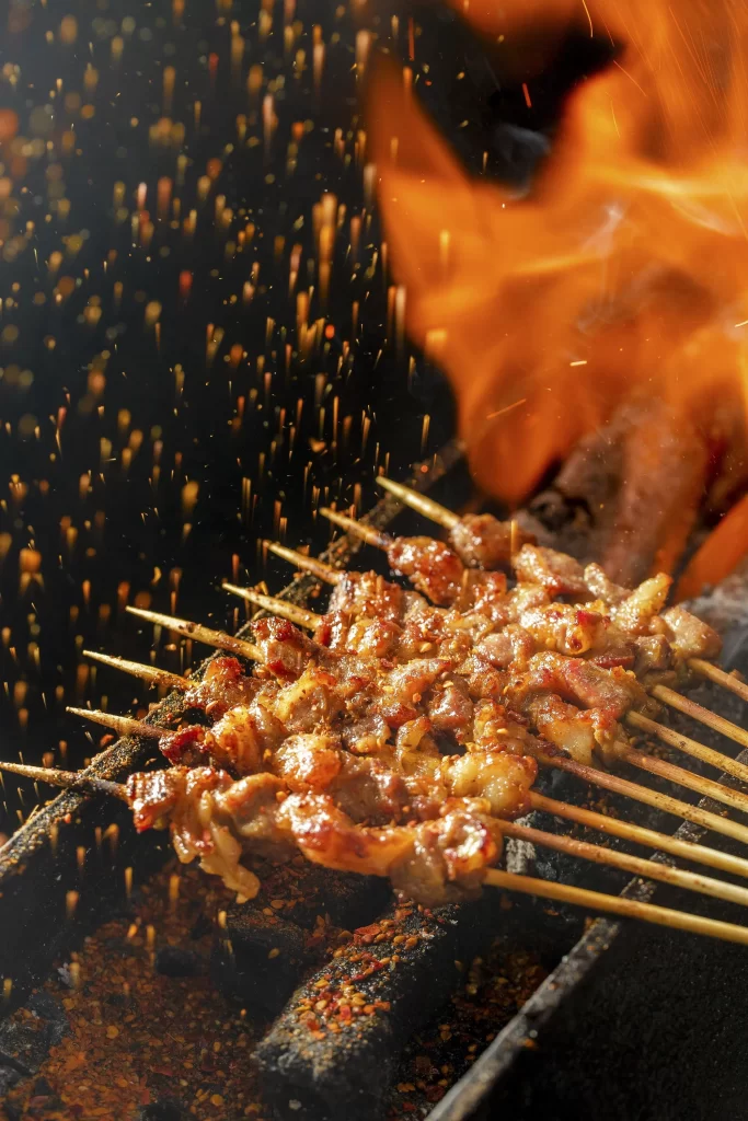 Charred Pork Skewers Golden Brown Crispy Texture Close Up