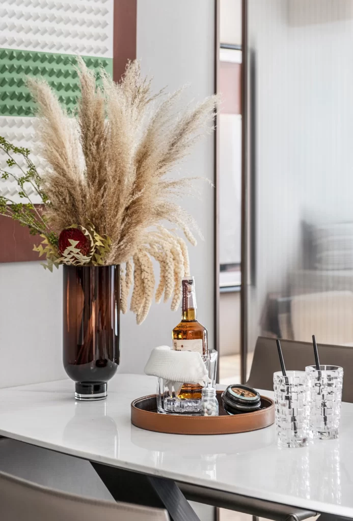 Contemporary Dining Space Neutral Tones Glass Table Decorative Vase